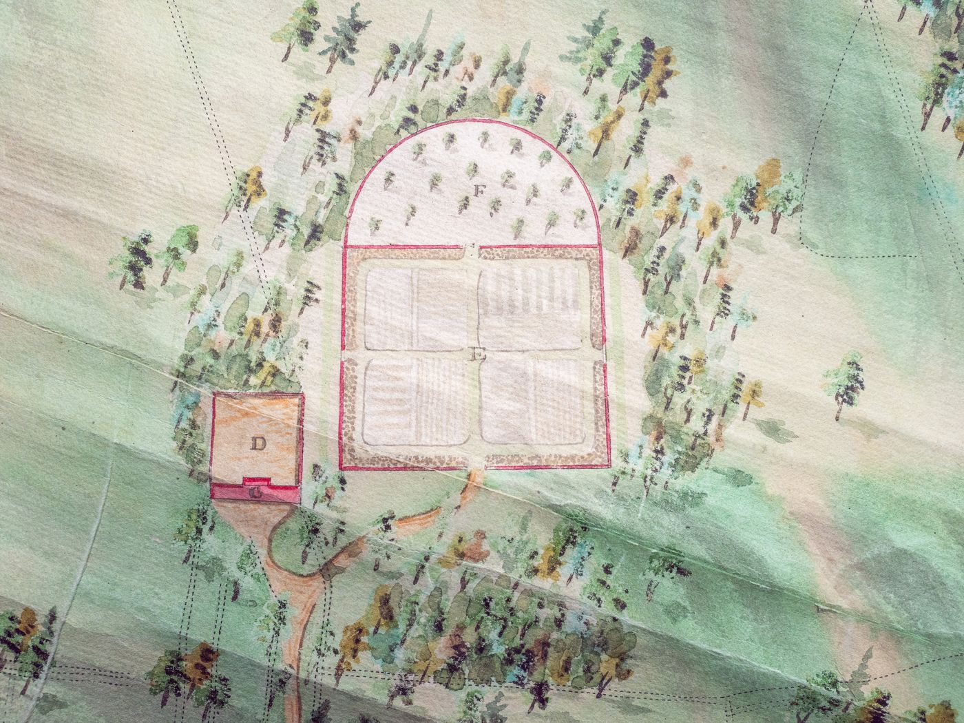 A detail from an 18th-century estate plan showing the walled garden, labelled Kitchen Garden and Orchard, already divided into quarters